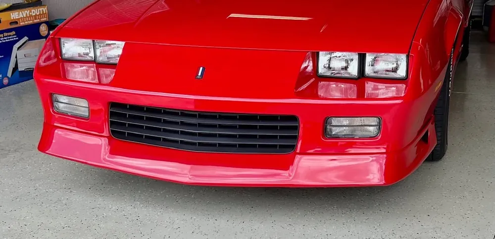 Red sports car parked inside the Harrell's Main Street Automotive shop