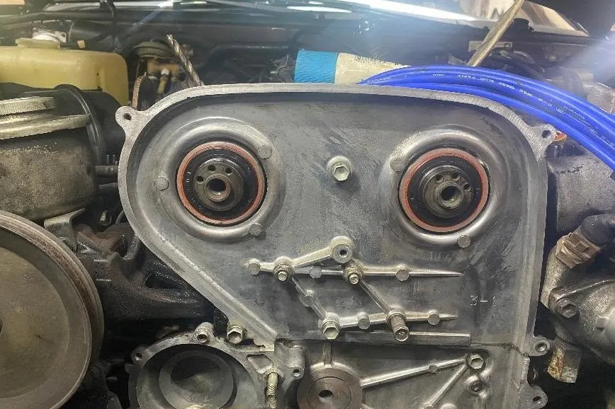 Engine front with timing components exposed during repair