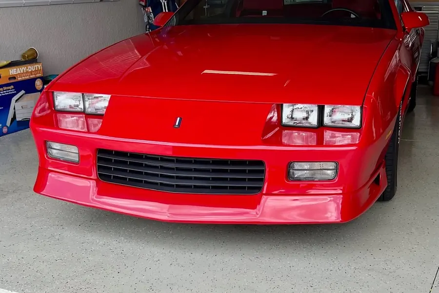 Red sports car inside the shop