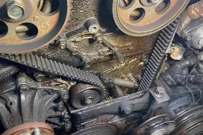 Timing belt and pulleys in an engine bay